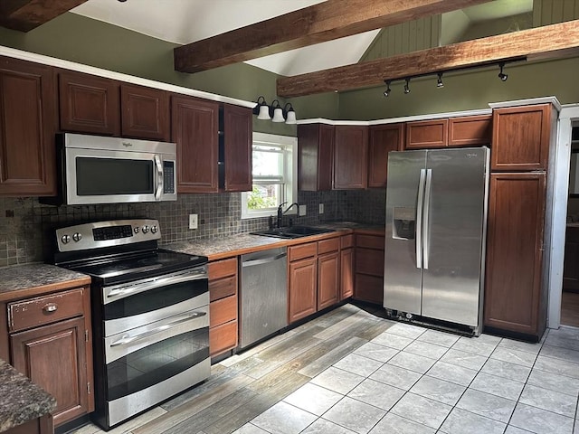 110 School St, Warren, MA 01083 - kitchen with appliances with stainless steel finishes, backsplash, and light wood-style flooring