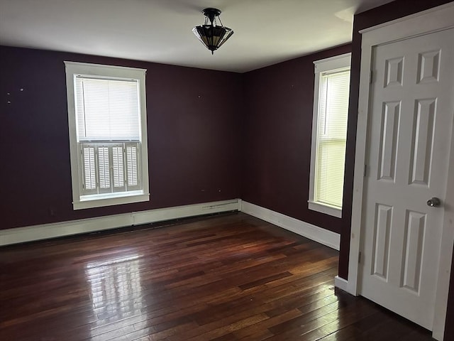 110 School St, Warren, MA 01083 - spare room featuring dark wood finished floors and a baseboard heating unit