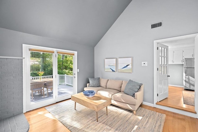 154 Mann Lot Rd, Scituate, MA 02066 - living room with light wood finished floors and high vaulted ceiling