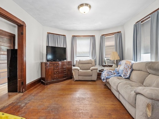 210-212 Brown St, Waltham, MA 02453 - living area featuring wood finished floors and cooling unit