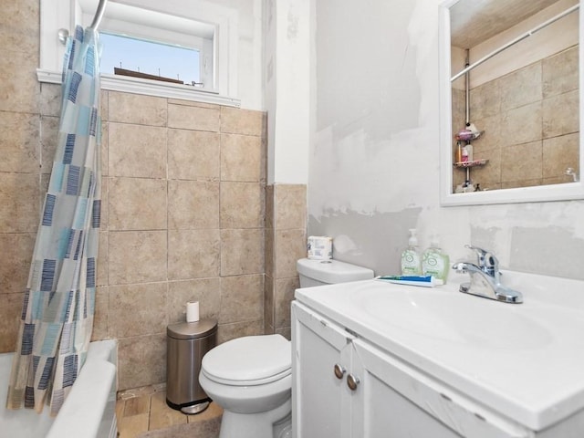 210-212 Brown St, Waltham, MA 02453 - full bathroom featuring tile walls, vanity, and shower / bathtub combination with curtain