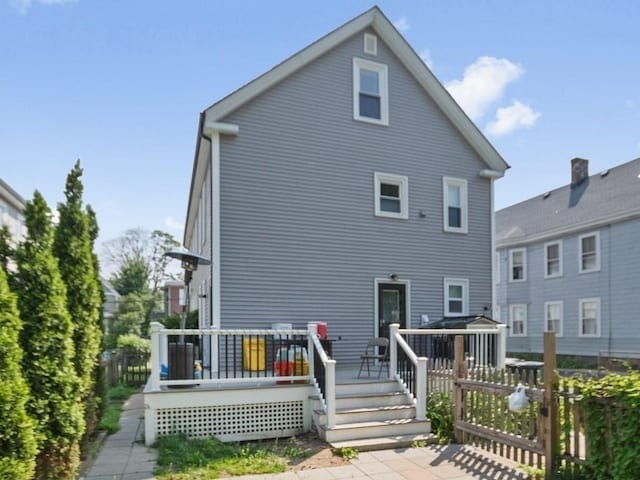 210-212 Brown St, Waltham, MA 02453 - rear view of house with a wooden deck
