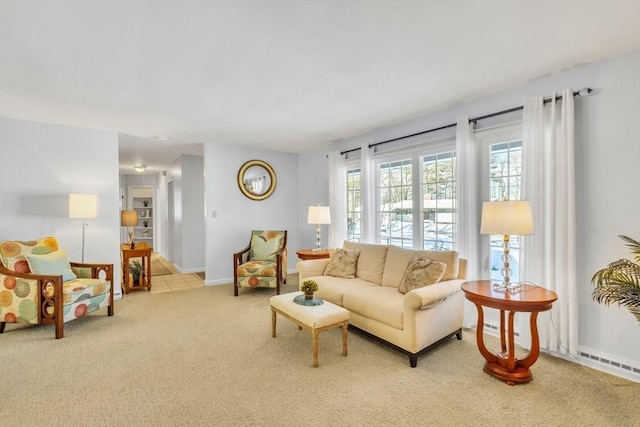 living room featuring carpet and baseboards