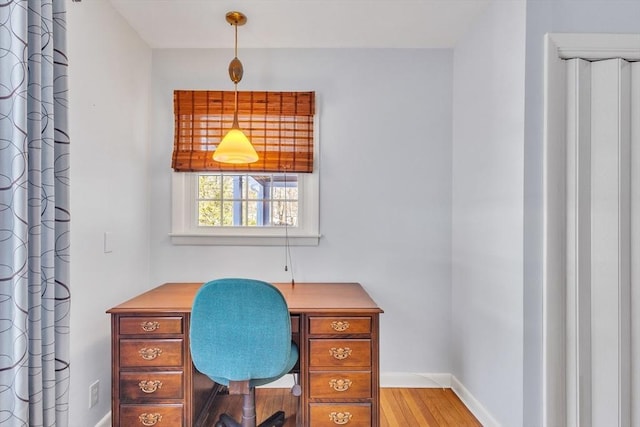 office featuring wood finished floors and baseboards