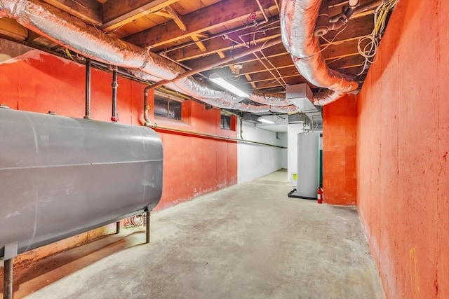 unfinished basement featuring water heater and heating fuel