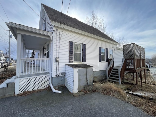 view of property exterior with covered porch