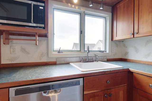 kitchen with sink and appliances with stainless steel finishes