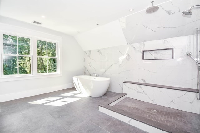 bathroom with vaulted ceiling and shower with separate bathtub