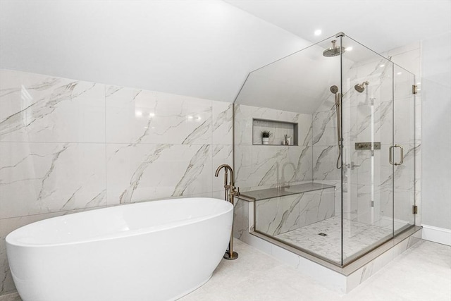 bathroom with vaulted ceiling and separate shower and tub