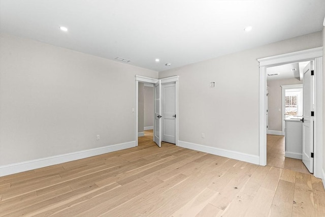 unfurnished bedroom with light wood-type flooring