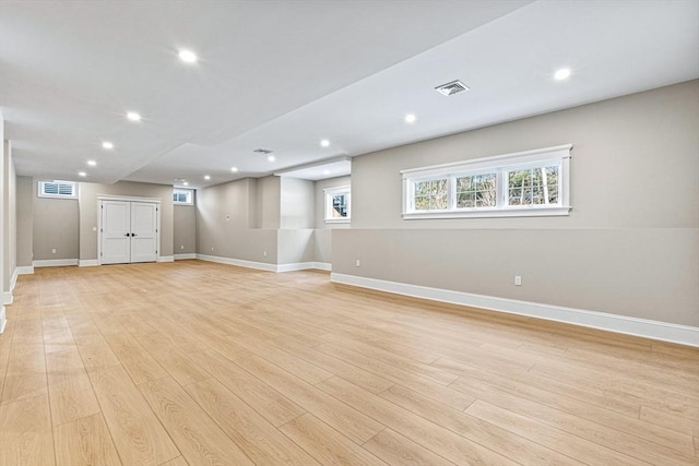 basement featuring light hardwood / wood-style floors