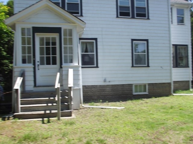 286 Fisher St, Walpole, MA 02081 - view of front facade featuring a chimney and a front lawn