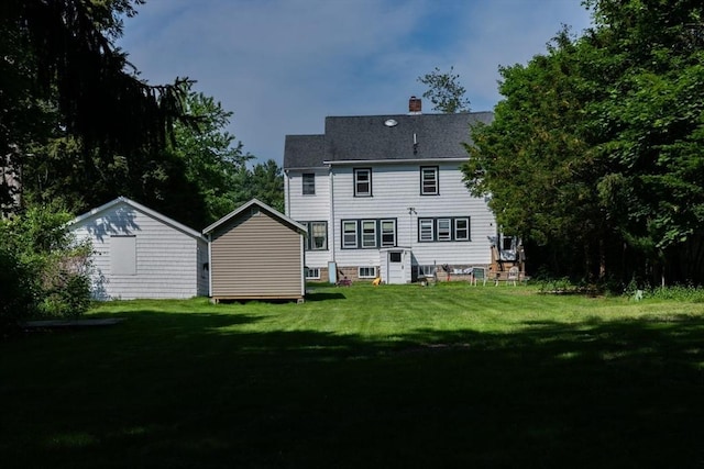 286 Fisher St, Walpole, MA 02081 - rear view of property featuring a chimney and a yard