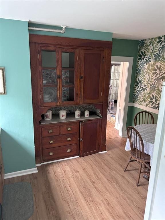 286 Fisher St, Walpole, MA 02081 - bar area with wallpapered walls and light wood-style flooring