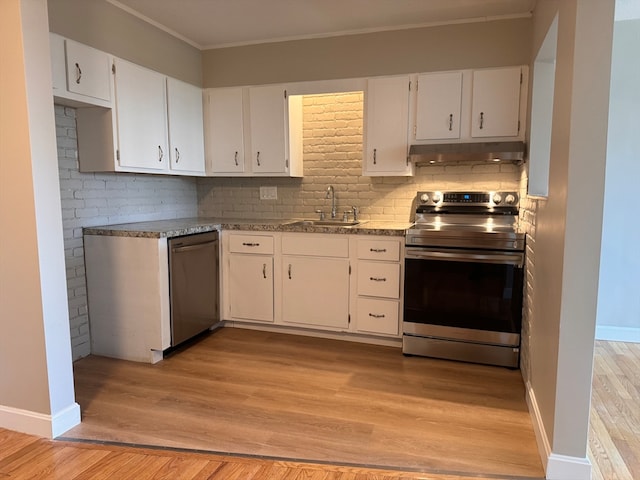 kitchen featuring sink, appliances with stainless steel finishes, white cabinetry, and light hardwood / wood-style floors