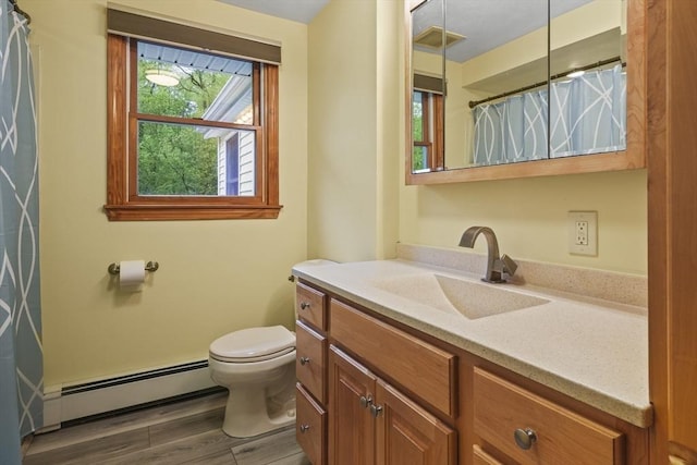full bathroom featuring a baseboard radiator, toilet, wood finished floors, vanity, and a shower with shower curtain