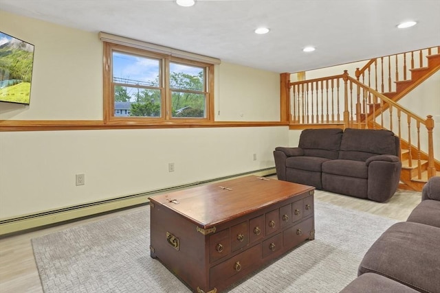 living room featuring light wood-style floors, recessed lighting, stairs, and a baseboard radiator