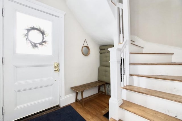 foyer entrance featuring hardwood / wood-style flooring and vaulted ceiling