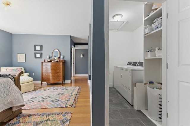 bedroom with baseboards and washing machine and dryer