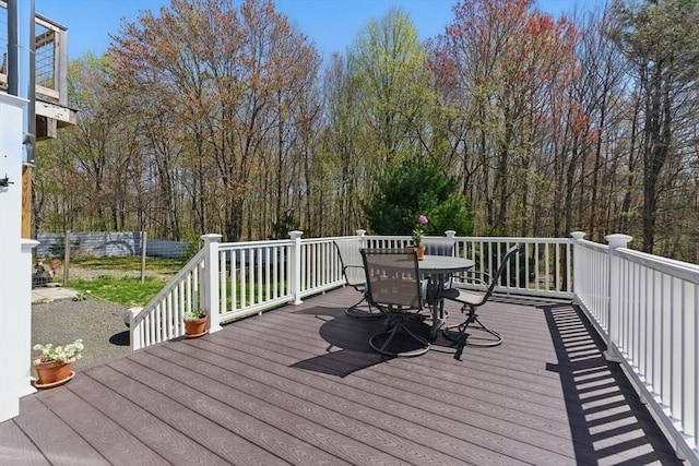 wooden terrace with outdoor dining area