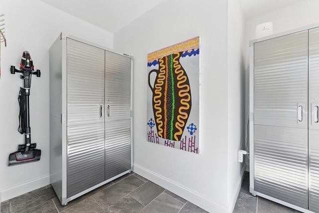 interior space featuring baseboards