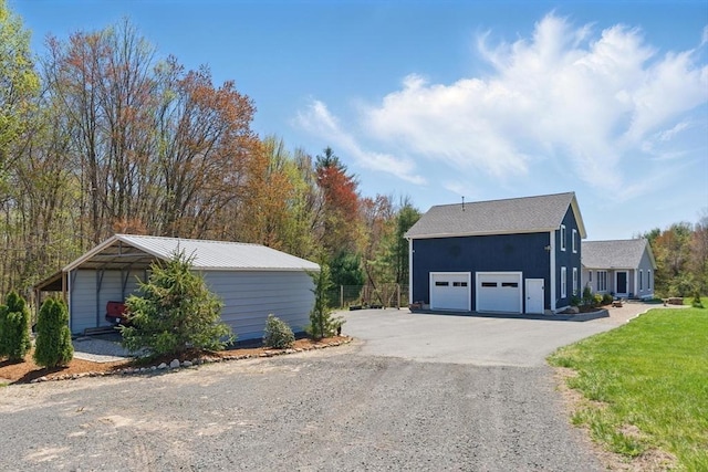 view of home's exterior with a lawn, driveway, and a garage