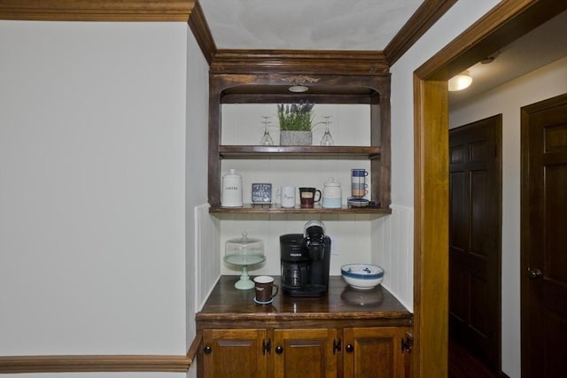 bar with crown molding and a dry bar