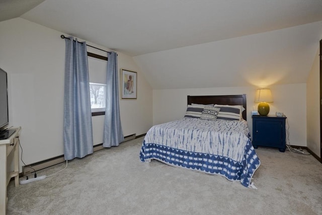 carpeted bedroom with baseboards and lofted ceiling