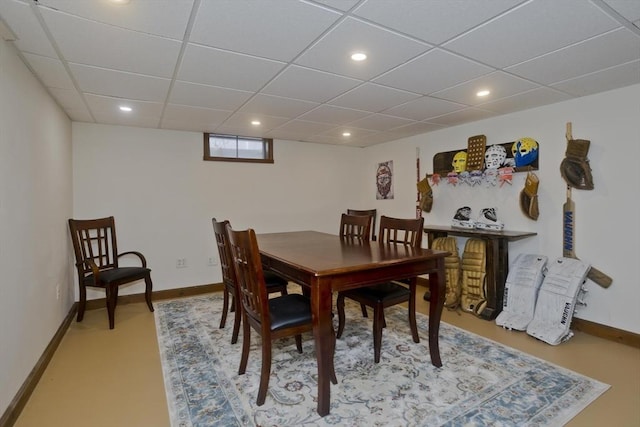 dining area with baseboards, recessed lighting, and a paneled ceiling