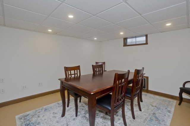 dining room with baseboards, recessed lighting, and a paneled ceiling
