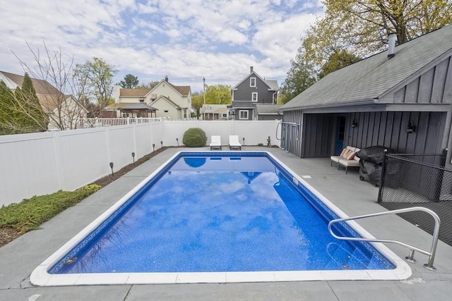 view of pool with a fenced backyard, a fenced in pool, a patio, and a residential view