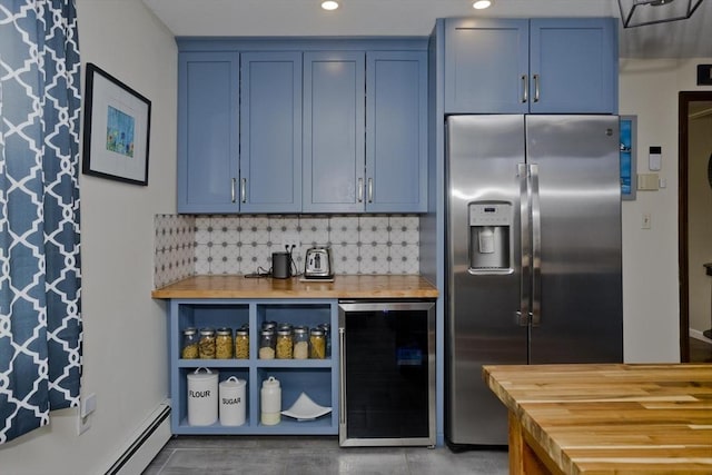 kitchen with blue cabinets, stainless steel fridge with ice dispenser, a baseboard radiator, wine cooler, and butcher block countertops