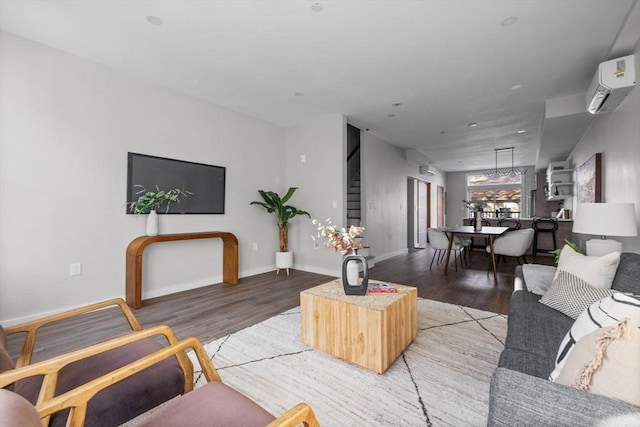 33 Copeland Unit F, Boston, MA 02119 - living area featuring light wood-type flooring, a wall mounted AC, and stairway