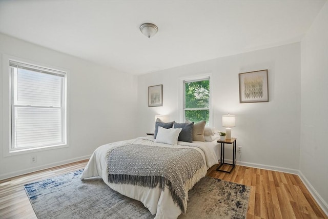 30 Balfour St, Boston, MA 02125 - bedroom featuring light wood-style flooring and baseboards