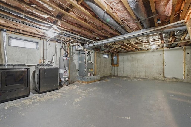 30 Balfour St, Boston, MA 02125 - below grade area featuring gas water heater, washing machine and clothes dryer, and heating unit