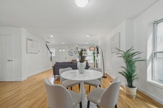 30 Balfour St, Boston, MA 02125 - dining room featuring stairs, baseboards, light wood finished floors, and recessed lighting