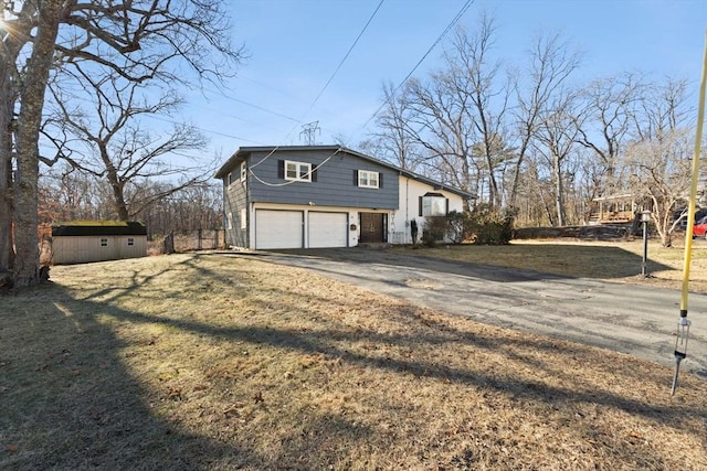 view of property exterior featuring a yard and a garage