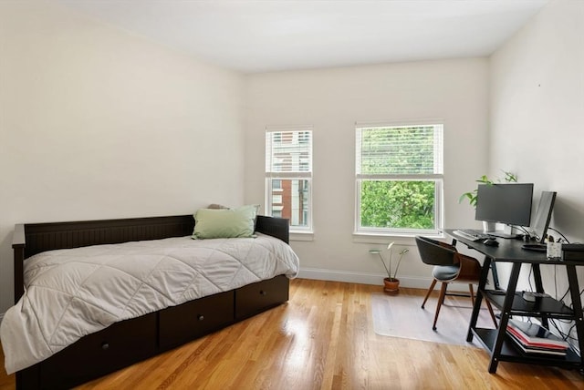 30 Edgerly Unit 4, Boston, MA 02115 - bedroom with wood finished floors, baseboards, and a desk