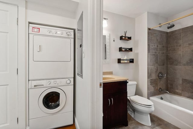 30 Edgerly Unit 4, Boston, MA 02115 - bathroom featuring stacked washing machine and dryer, vanity, toilet, and  shower combination