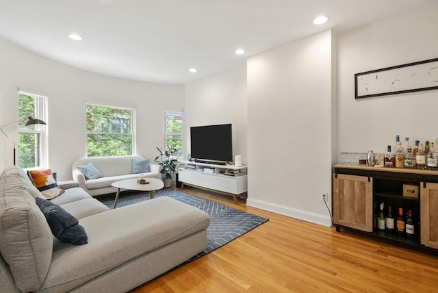 30 Edgerly Unit 4, Boston, MA 02115 - living area with a bar, light wood finished floors, recessed lighting, and baseboards
