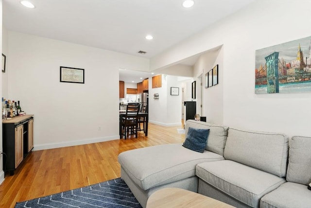 30 Edgerly Unit 4, Boston, MA 02115 - living area with recessed lighting, light wood-type flooring, a bar, and baseboards