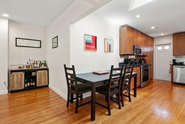 30 Edgerly Unit 4, Boston, MA 02115 - dining area with light wood-style floors, a dry bar, recessed lighting, and baseboards