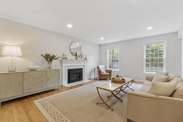 3 Misty Ln, Westford, MA 01886 - living area featuring a fireplace with flush hearth, light wood-style floors, recessed lighting, and baseboards