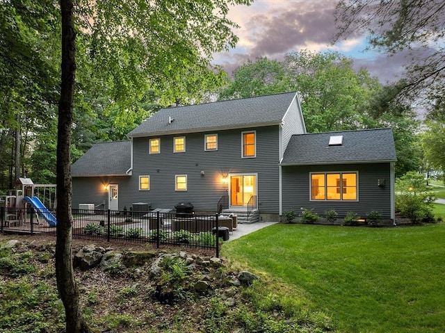 3 Misty Ln, Westford, MA 01886 - back of house featuring a patio, entry steps, a shingled roof, and a playground
