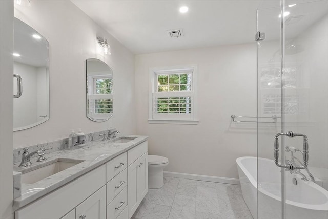3 Misty Ln, Westford, MA 01886 - bathroom featuring a soaking tub, baseboards, double vanity, marble finish flooring, and toilet