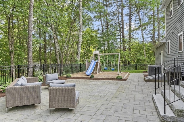 3 Misty Ln, Westford, MA 01886 - fenced backyard featuring a patio area, an outdoor living space, a playground, and view of wooded area