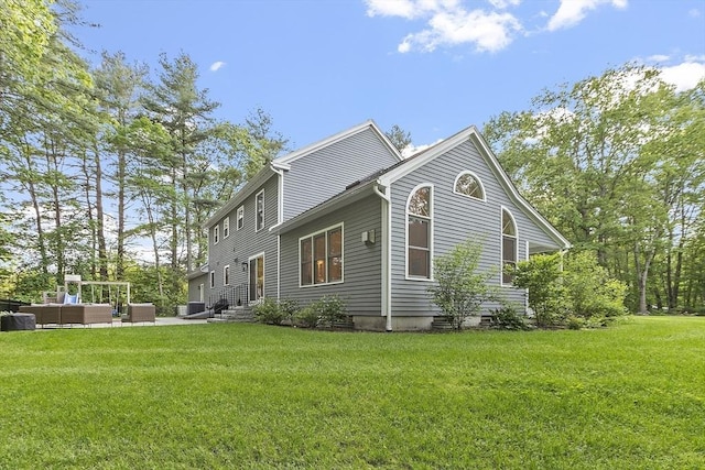 3 Misty Ln, Westford, MA 01886 - view of side of property featuring an outdoor living space, a lawn, central AC unit, and entry steps
