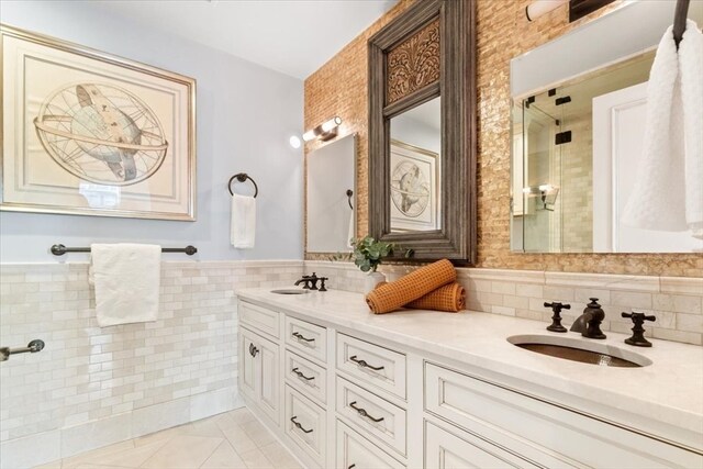 bathroom featuring vanity, tile walls, and a shower with door