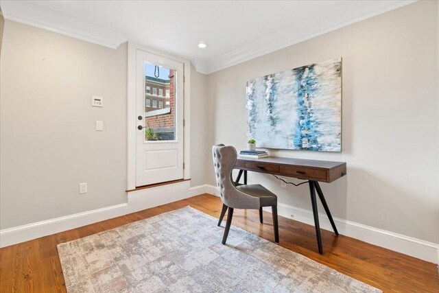 office space with crown molding and hardwood / wood-style floors