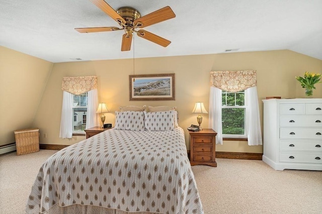 bedroom with vaulted ceiling, light carpet, baseboards, and visible vents